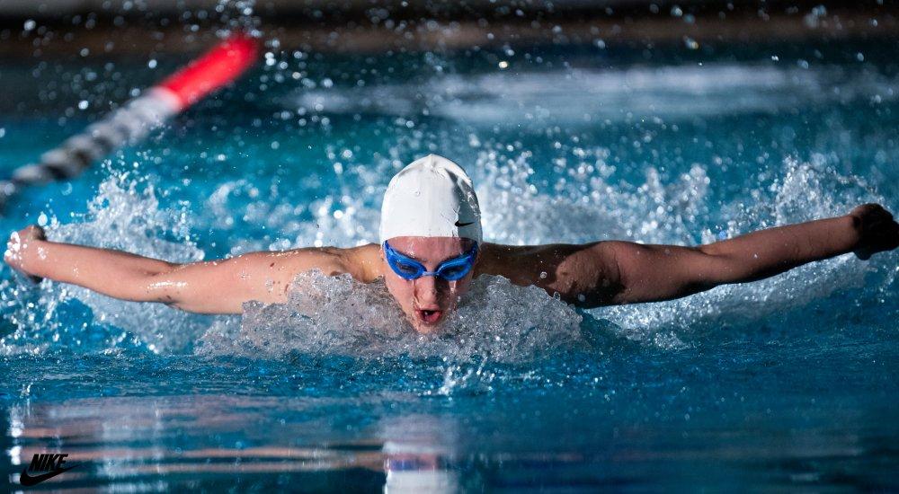 man swimming competitively 